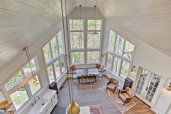 TV, fireplace, books - Enchanting Tryon Home w/ Hot Tub ~ 14 Mi to Tiec! (Tryon)