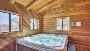 A wooden cabin with a hot tub, large windows, and a wooden ceiling. - Cottonwood Cabin w/ Private On-site Fly Fishing! (Blanco)