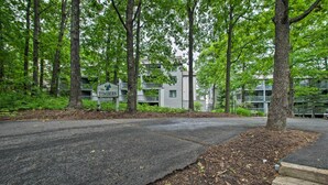 A road leading to a building with a sign reading "The Timber's." - Ski-in Ski-out Condo w/ Balcony & Slope Views! (Nellysford)