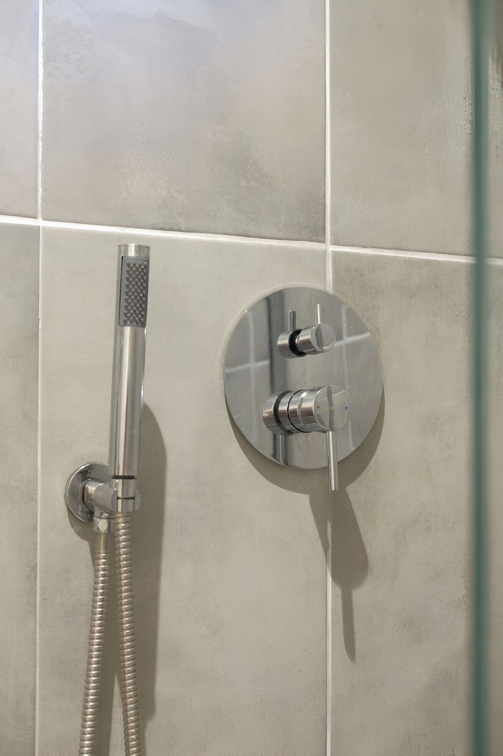 A bathroom with a shower and a sink.