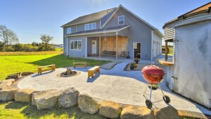 A house with a covered patio, a barbecue grill, and a stone fire pit. - Lakefront Wisconsin Dells Home w/ Game Room (Wisconsin Dells)