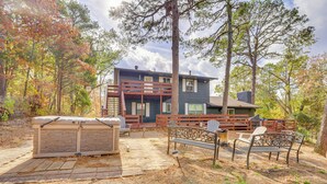 A two-story house with a deck, outdoor seating, and a hot tub. - Beaver Lake Home ~ 8 Mi to Downtown Rogers! (Rogers)