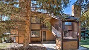 A modern building with a wooden exterior, a staircase, and a small balcony. - Renovated Park City Condo: Hike, Bike & Ski! (Park City)