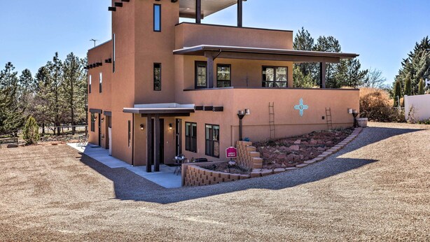 A modern two-story building with a flat roof and a covered patio area. - Quaint Kanab Casita - 3 Mi to the Heart of Town! (Kanab)
