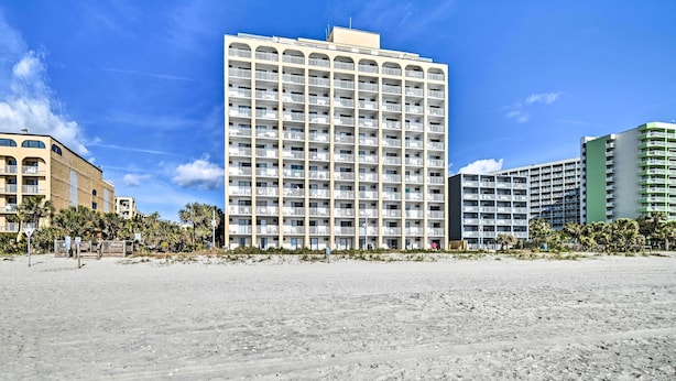 A multi-story hotel with balconies, located near a sandy beach. - 4 Mi to Broadway at the Beach: Oceanfront Getaway (Myrtle Beach)