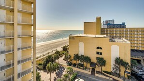 A multi-story hotel with balconies overlooking a beach. - 4 Mi to Broadway at the Beach: Oceanfront Getaway (Myrtle Beach)
