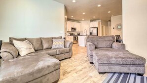 A modern living room with two sofas and a kitchen in the background. - St George Area Townhome w/ Patio + Pool Access (Washington)
