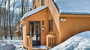 A wooden cabin with a front door, steps, and a small porch area. - Cozy Conway Area Home ~ 4 Mi to Cranmore Mountain! (Intervale)