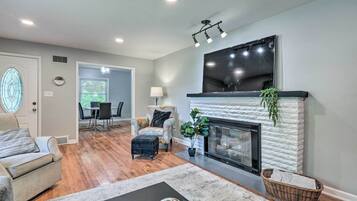 TV, fireplace, books