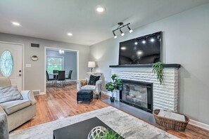TV, fireplace, books
