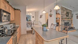 A spacious kitchen with granite countertops, stainless steel appliances, and a central island. - Oakland Retreat ~ 13 Mi to Deep Creek Lake! (Oakland)
