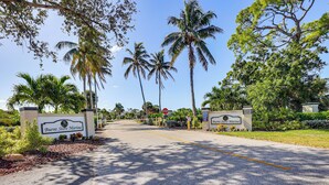 A road leading to a property with a sign reading "Burnt Store Marina". - Waterfront Condo w/ Pool Access in Punta Gorda! (Punta Gorda)