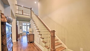 A wooden staircase with a white railing leading to a second floor. - 2 Mi to Dtwn: Home in Noda District Near Unc! (Charlotte)