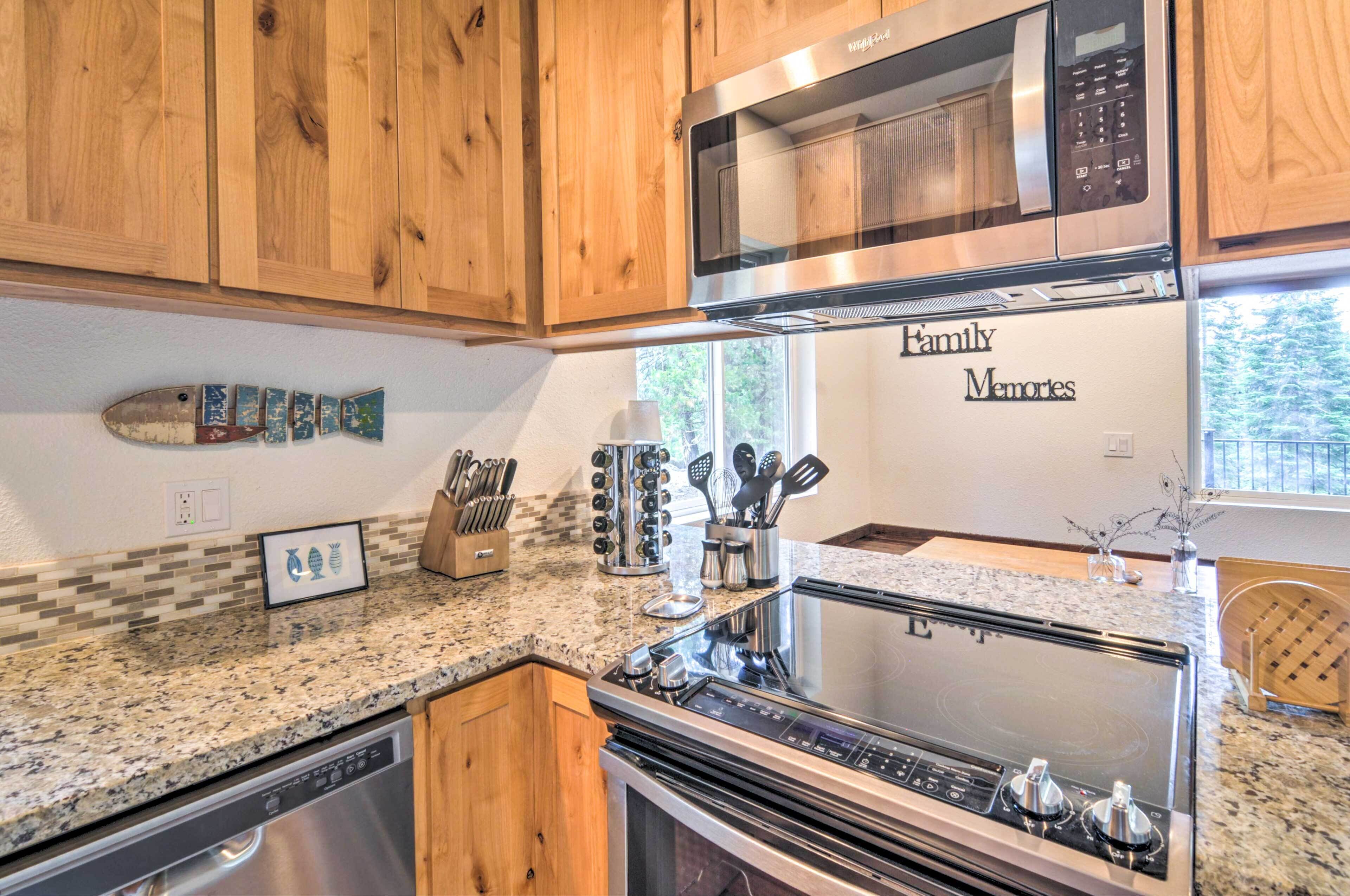 A kitchen with wooden cabinets, a stainless steel microwave, a stove, and a dishwasher.