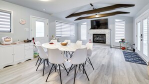 A modern kitchen with white cabinets, a built-in oven, and a large island with a sink. - 8 Mi to Tobyhanna State Park: Poconos Home! (Tobyhanna)