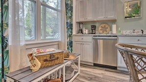 A kitchen with a built-in dishwasher, a coffee maker, and a fruit bowl on the counter. - Hike & Ski! Blue Heron Brodheadsville Cottage (Brodheadsville)