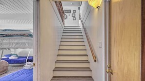 A staircase with wooden steps leading to a landing. - Furnished Deck & Nat'l Forest Views: Arnold Cabin (Arnold)