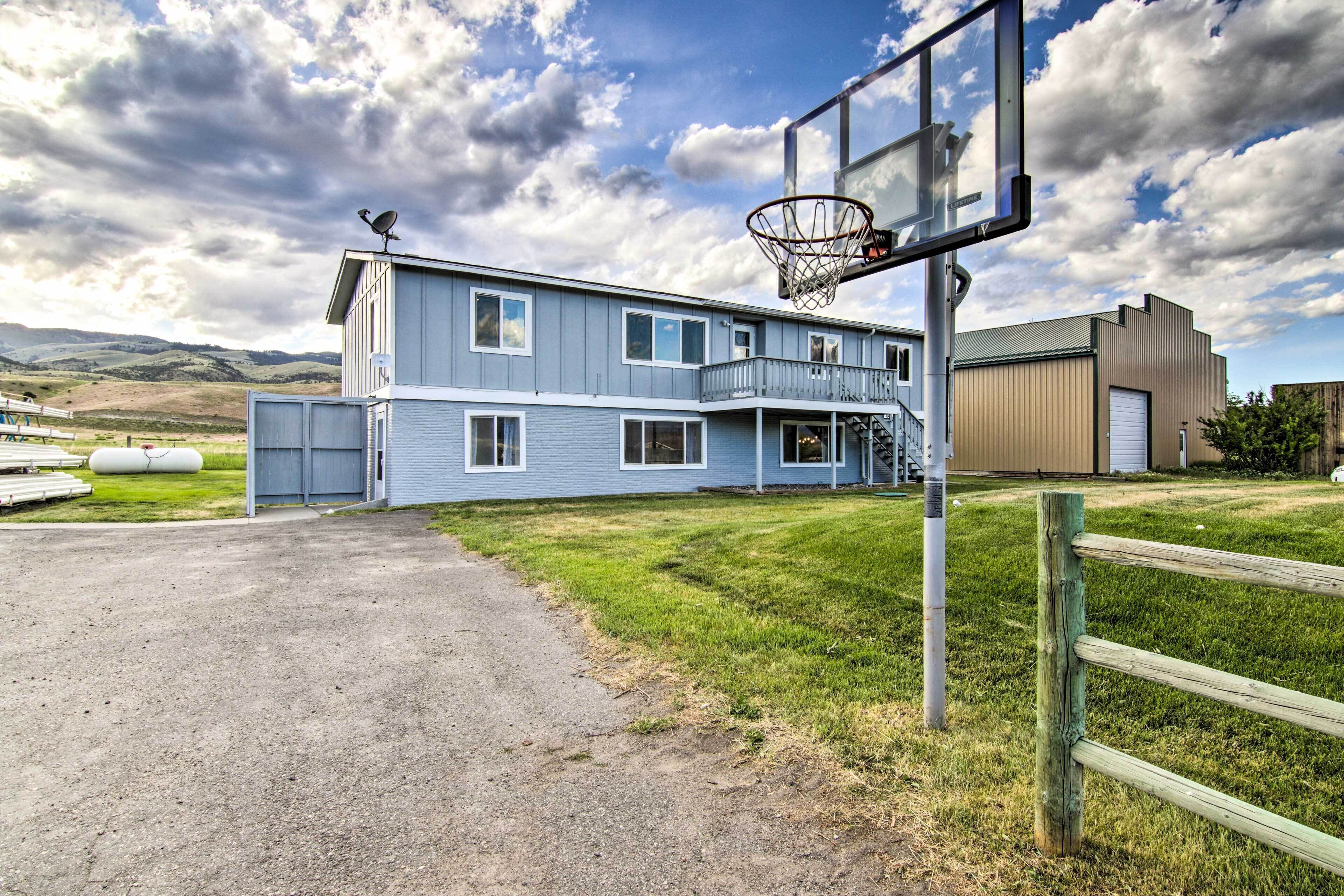A two-story building with a basketball hoop in front.