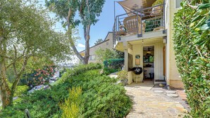A stone pathway leading to a house with a balcony and a garage. - 16 Mi to Beaches & Wineries! Chic Peaceful Retreat (Santa Paula)