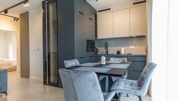 Family Apartment | Private kitchenette | Fridge, microwave, stovetop, dishwasher