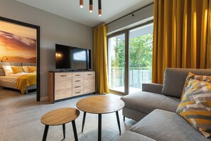 Classic Apartment | Living area | 37-inch flat-screen TV with satellite channels, TV