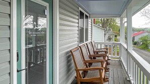 A porch with rocking chairs, a covered area, and a view of neighboring houses. - Cozy Fries Escape w/ Mountain & River Views! (Fries)