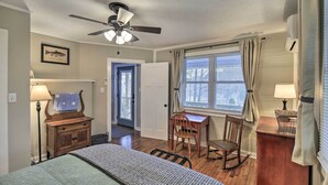 A bedroom with a bed, a desk, a rocking chair, a ceiling fan, and a window with curtains. - Cozy Fries Escape w/ Mountain & River Views! (Fries)