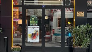 The storefront of SUFI HOMES with a glass door, a sign indicating the number 4, and a poster advertising a Sufi class. - Sufi Homes (Konya)