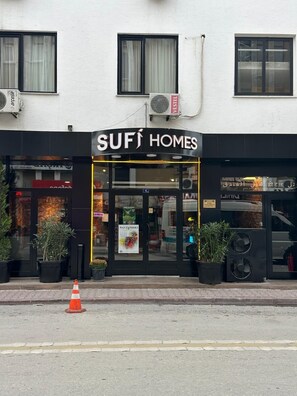 A storefront with a black awning and the sign "SUFI HOMES". - Sufi Homes (Konya)