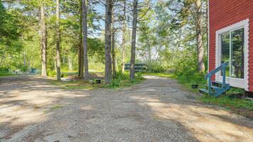 Escape to a secluded cabin nestled among the trees, surrounded by nature's tranquility.