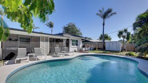 A modern house with a swimming pool, outdoor seating, and a covered patio. - 8 Mi to Beaches: Bradenton Home w/ Poolside Oasis! (Bradenton)
