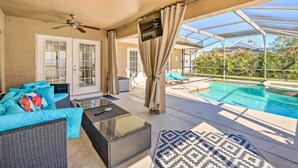 A covered outdoor area with a pool, seating, and a ceiling fan. - Clermont Vacation Rental w/ Pool: 11 Mi to Disney (Clermont)