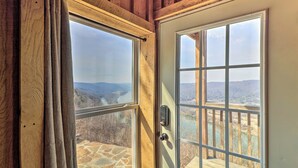 A wooden-framed door with a view of a river and mountains. - Peaceful Mountain Air Getaway w/ Fire Pit! (Mountain View)