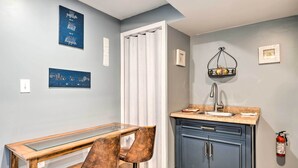 A kitchen with a sink, cabinets, and a fire extinguisher. - Home w/ Fire Pit - 8 Mi to Dtwn Mile Square! (Indianapolis)