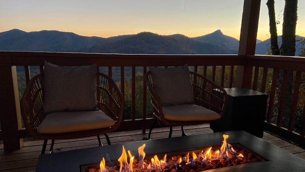 A deck with two wicker chairs and a fire pit. - Sapphire 5BR Luxe: 5 Private Baths, Mtn Views (Sapphire)