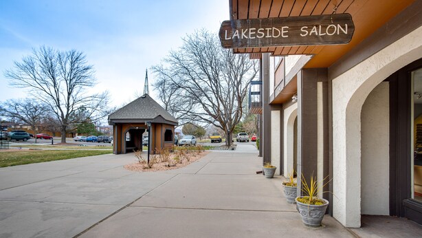 A building with a sign reading "Lakeside Salon" and a small gazebo-like structure in front. - Grand Junction Vacation Rental: Indoor Pool Access (Grand Junction)