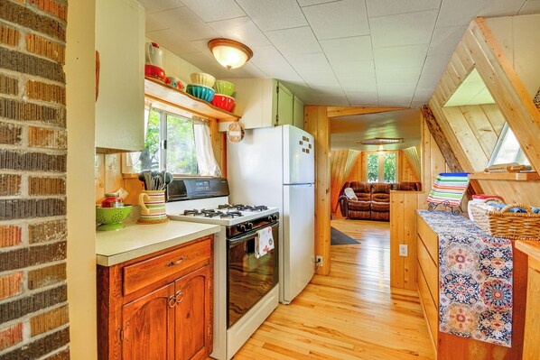Enjoy cooking in this well-appointed kitchen with a stove, oven, and refrigerator.