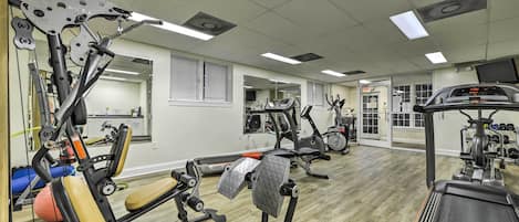 A gym with various exercise equipment, including treadmills and weight machines.