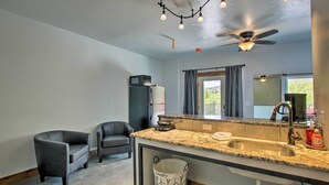 A modern bathroom with a large sink, a ceiling fan, and a mirror. - Modern Lava Hot Springs Studio, Walk to Pools (Lava Hot Springs)