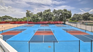 A tennis court with multiple courts, surrounded by a fence and trees. - Walk to Parks & Dining! Updated Ybor City Home (Tampa)