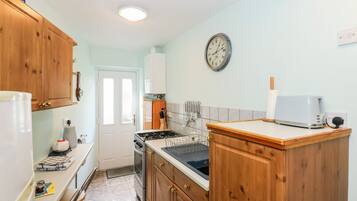 Fridge, electric kettle, toaster, cookware/dishes/utensils