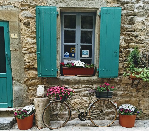 Typical stone house, in a small cobbled street, behind the chateau of Cesseras..
