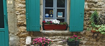 Typical stone house, in a small cobbled street, behind the chateau of Cesseras..