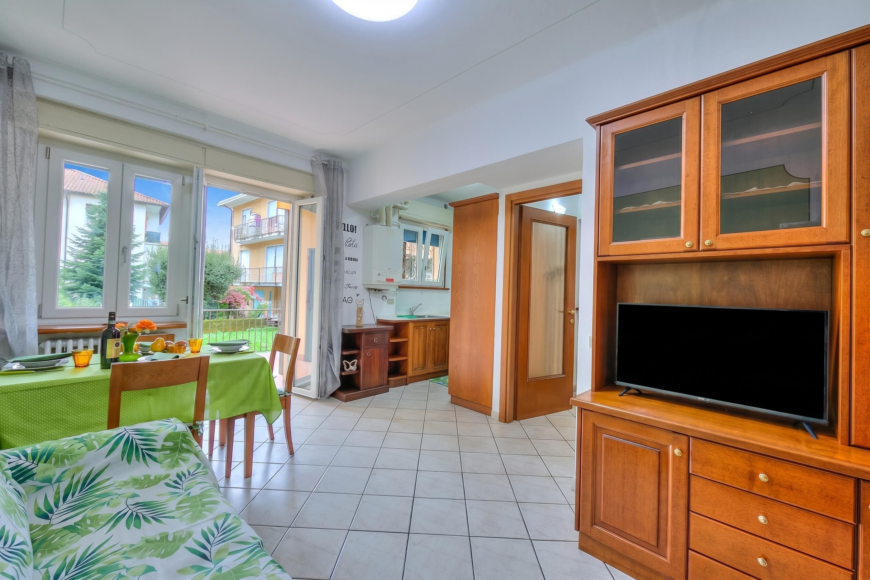 Family Apartment, 2 Bedrooms, Microwave (Leonardo House Garden Stresa Center) | Living area | 21-inch TV with digital channels
