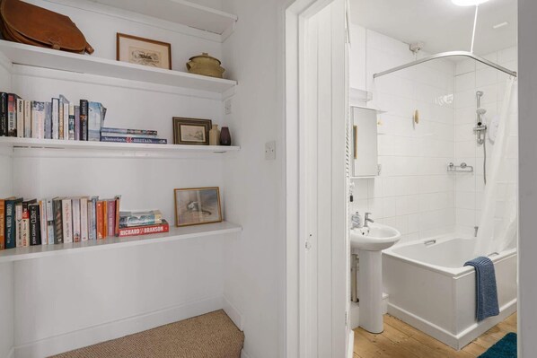 Bathtub, hair dryer, towels