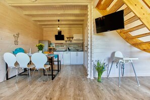 Enjoy cooking in this kitchen with a dishwasher, dining area, and flat-screen TV.
