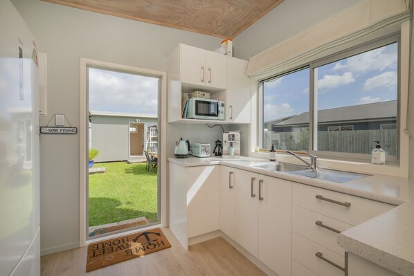 Fridge, microwave, coffee/tea maker, toaster