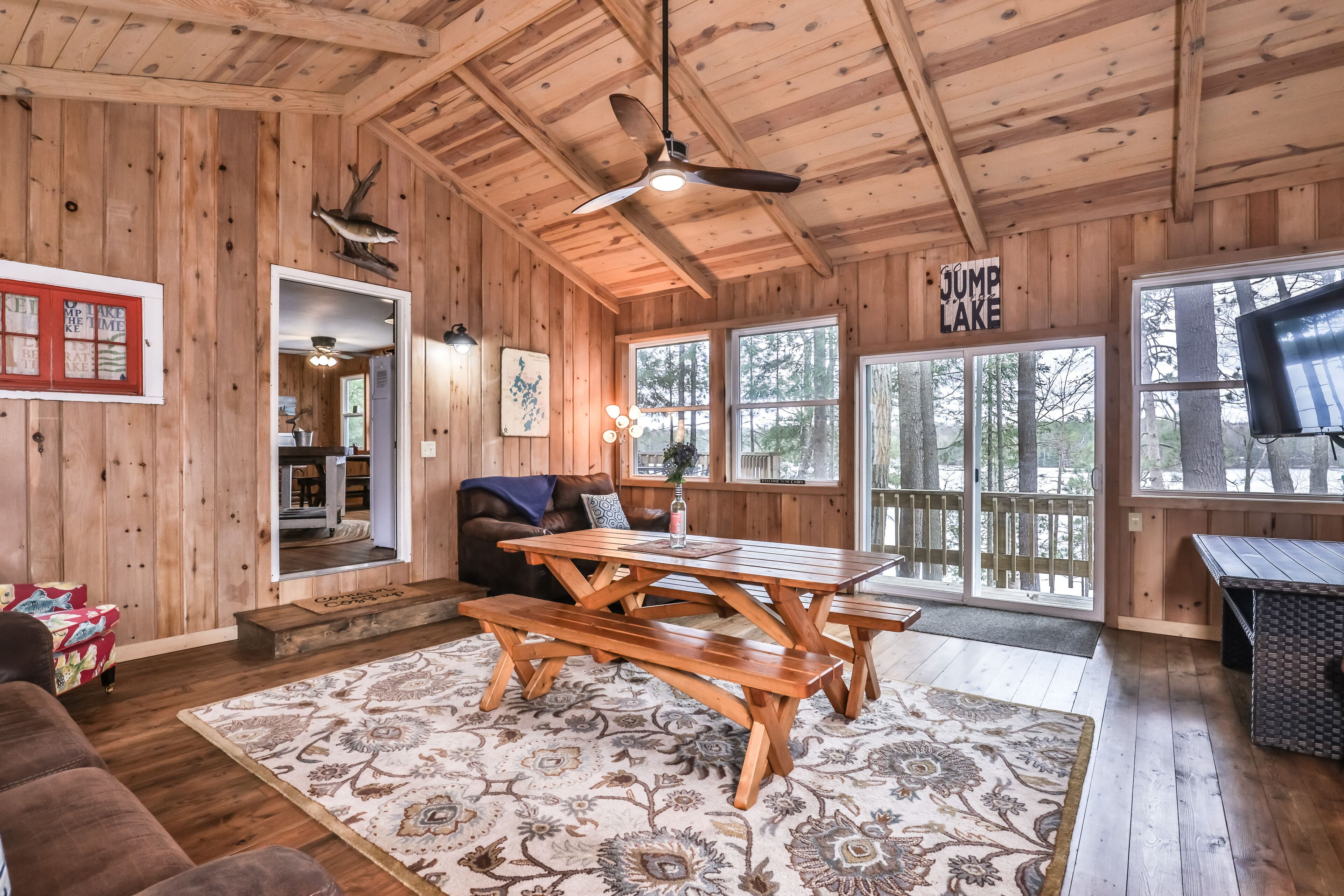 Splendid lakefront home with deck, private W/D, fireplace, and patio area