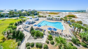 A resort with a central swimming pool, outdoor seating, and a beach view. - 4BR Spacious Beach Home with Private Pool+ Studio Apartment | Southern Nights (Destin)