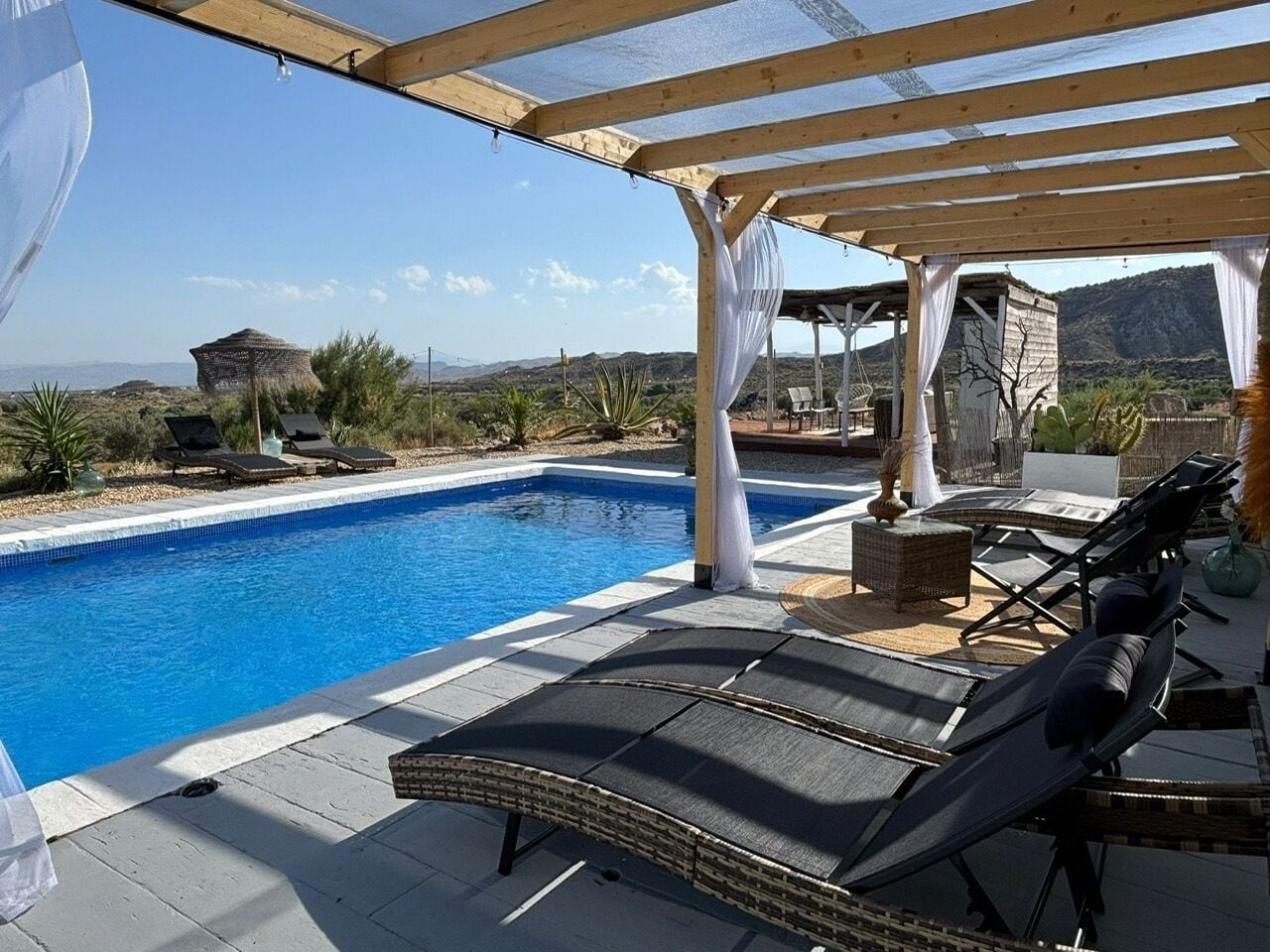 Outdoor pool, pool umbrellas, pool loungers